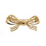 Unmarked gold bow brooch, (tests as 9ct gold) 3.5cm in length, 3.5g : For Further Condition