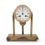 Continental brass three pillar mantle clock with enamel dial and Roman numerals, 25cm high : For