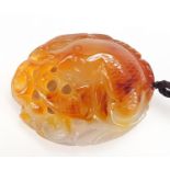 Chinese agate pendant carved with a fish, 7.5cm high : For Further Condition Reports Please Visit