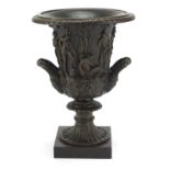 Large patinated bronze classical campana urn with twin handles decorated in relief with classical