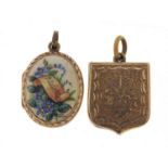 Victorian gold coloured metal and enamel locket and a shield shaped example, the largest 2cm