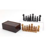 Boxwood and ebonised chess set housed in a stained pine case, the largest piece 8.5cm high : For