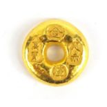 Chinese gold coloured metal ingot, impressed marks, 4cm in diameter : For Further Condition