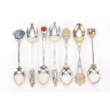 Seven golfing interest silver teaspoons, some with enamelled terminals, various hallmarks, the