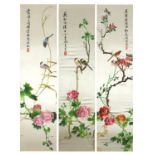 Set of three Chinese silk panels embroidered with birds amongst flowers, each with calligraphy, each