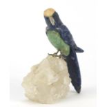 Chinese lapis lazuli, jade and hardstone parrot perched on a naturalistic rock crystal base, 14cm