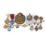 Military and other badges and jewels including silver masonic jewel, The Royal Sussex Regiment