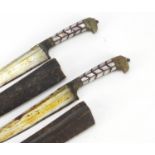 Pair of Indo-Persian pesh kabz daggers with mother of pearl handles and leather sheaths, each 29cm