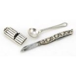 Victorian silver whistle, silver mustard spoon and a folding fruit knife, various hallmarks, the
