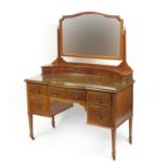 Edwardian mahogany dressing table with mirrored back and a series of drawers, 155cm H x 121cm W x