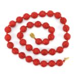 Chinese carved cinnabar lacquer bead necklace with gold coloured metal clasp, 68cm in length : For