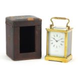 Brass cased carriage clock by Sly & Co of Barnstaple, with key and leather travelling case,