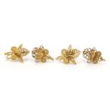 Two pairs of unmarked gold filigree flower earrings, (tests as 9ct gold) the largest 2cm in