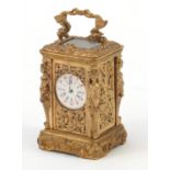 Charles Frodsham style miniature gilt carriage clock with figural pillars and circular dial having