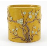 Chinese porcelain yellow ground brush pot hand painted and decorated in relief with peony blossom,