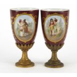 Pair of Vienna style porcelain vases with gilt metal pedestal bases, each decorated with a panel