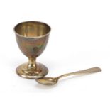 Chinese silver egg cup and spoon, engraved with a dragon, the spoon 9.5cm in length, 37.4g : For
