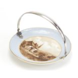 19th century porcelain plate with Continental silver swing handle, the plate hand painted with a