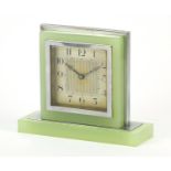 Art Deco chrome and lime green glass desk clock with silvered dial having Arabic numerals, 12cm high