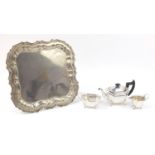 Three piece Sheffield silver plated tea set and a tray with engraved crest, the tray 42.5cm x 42.5cm