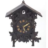 Black Forest cuckoo clock with Roman numerals and bone hands 48cm x 39cm : For Further Condition