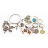 Silver and white metal jewellery including a pair of natural amber earrings, rings and pendants,