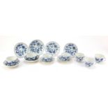 Meissen cups and saucers hand painted in the Blue Onion pattern comprising seven cups and six