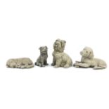 Four stoneware model dogs, the largest 38cm in length : For Further Condition Reports Please Visit