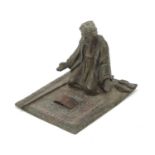 Cold painted spelter figure of Arab praying, in the style of Franz Xaver Bergmann, 9cm in length :