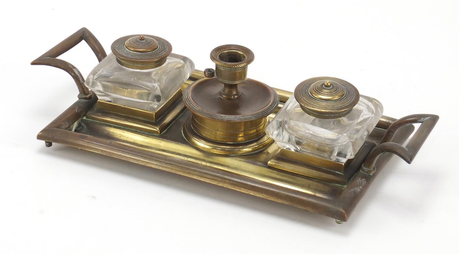 Victorian aesthetic style brass desk stand with two glass inkwells and a chamber stick, 23.5cm