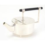 Modernist silver plated teapot with ebonised handle in the style of Christopher Dresser, 22.5cm in