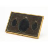 Victorian gilt brass portrait miniature, easel case with three oval apertures, 20cm x 12.5cm : For