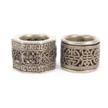 Two silver coloured metal archer's rings including one with rotating band : For Further Condition