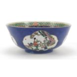 Chinese blue ground porcelain bowl hand painted in the famille rose palette with panels of