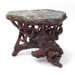 Chinese fluorite specimen tea table raised on a gnarled root base, 57cm H x 74cm W x 50cm D : For