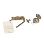 Military interest items including a Spitfire brooch and World War I compass by J Hicks London,
