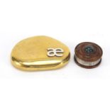 925 silver and brass pebble paperweight and a treen box with silver mount, the largest 6.5cm