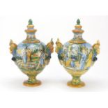 Pair of 19th century Italian Maiolica pottery vases and covers with twin figural handles, each