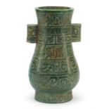 Large Chinese green jade archaic type vase, carved with grotesque heads and script, 24.5cm high :