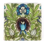 Arts & Crafts pottery tile hand painted in the Iznik manner with flowers, by William de Morgan,