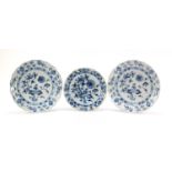 Two Meissen plates and a shallow bowl, each hand painted in the Blue Onion pattern, crossed sword