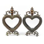 Pair of ornate bronzed love heart design candle holders, each 46.5cm high : For Further Condition