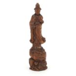 Chinese hardwood carving of Guanyin holding a sceptre standing on a rock, 21cm high : For Further