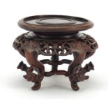 Good Chinese hardwood stand finely carved with flower heads and possibly Zitan, 9cm high x 12.5cm in