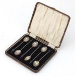 Set of six silver coffee bean spoons housed in a velvet and silk lined fitted box, indistinct