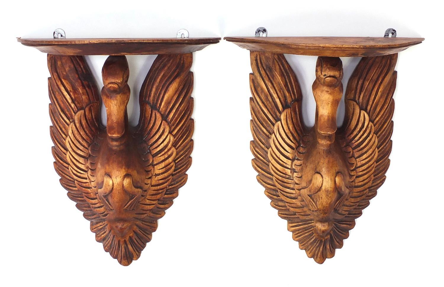 Pair of carved lightwood swan design wall brackets, each 44.5cm high : For Further Condition Reports