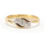 18ct gold diamond three stone crossover ring, size K, 2.8g : For Further Condition Reports Please