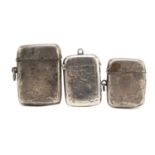 Three Victorian and later silver vestas with engraved decoration, Birmingham hallmarks, the