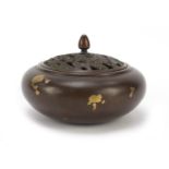 Chinese gold splashed patinated bronze incense burner with pierced cover, character marks to the