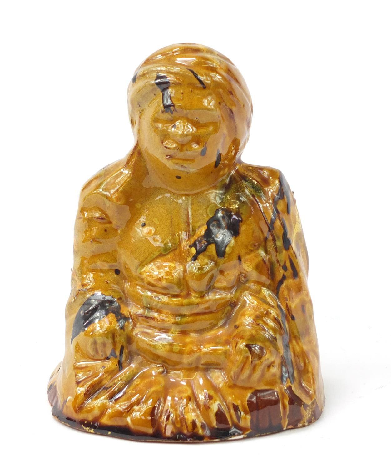 Turkish Canakkale pottery figure of a man having a yellow and brown glaze, 15.5cm high : For Further